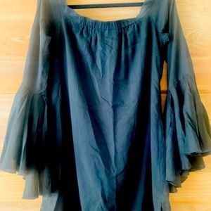 Off shoulder black mini in lightweight fabric with dramatic bell sleeves